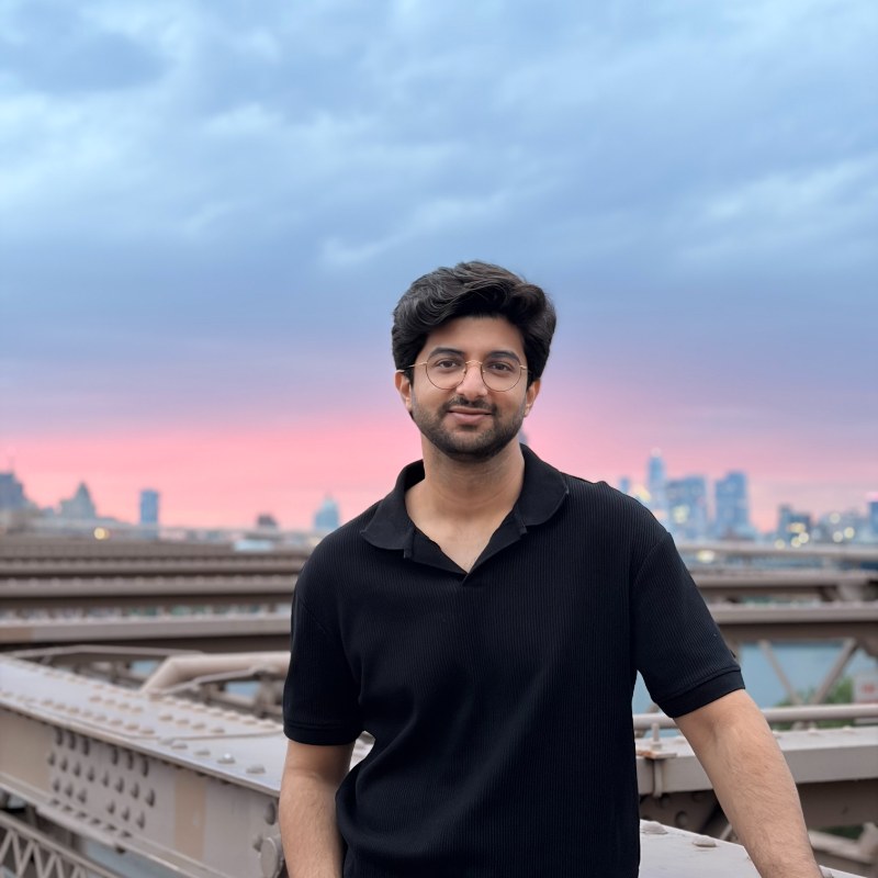 Ronnie, photographed at sunset with a city skyline behind him